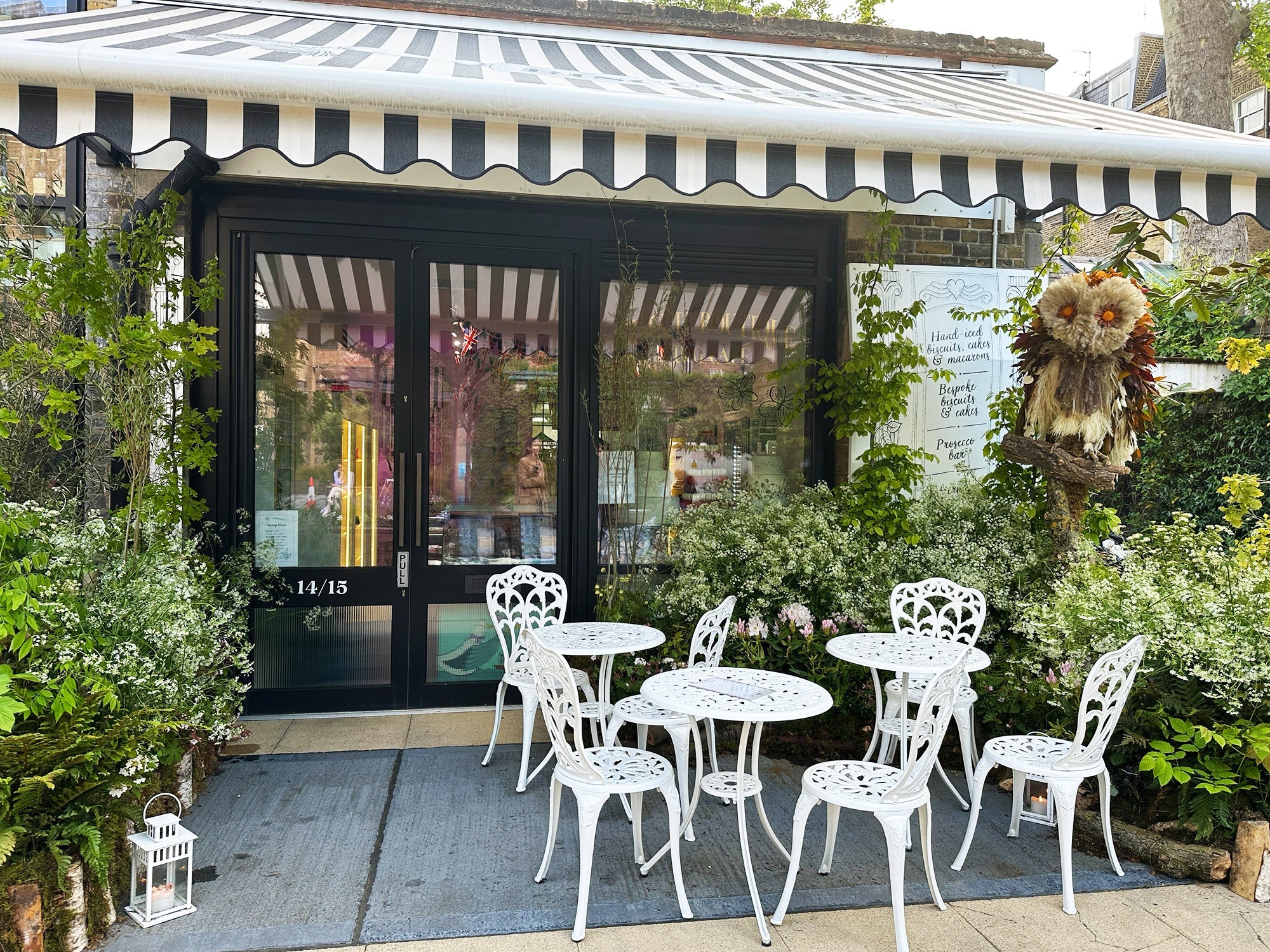 Biscuiteers Belgravia boutique blooms with floral owl display for 'Into the Wild' festival, perfect for spring gifting.