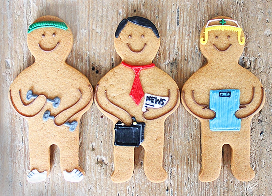 Hand-iced Jolly gingers for Aviva's Life Protection Solutions campaign by Biscuiteers, perfect for personalised gifts.