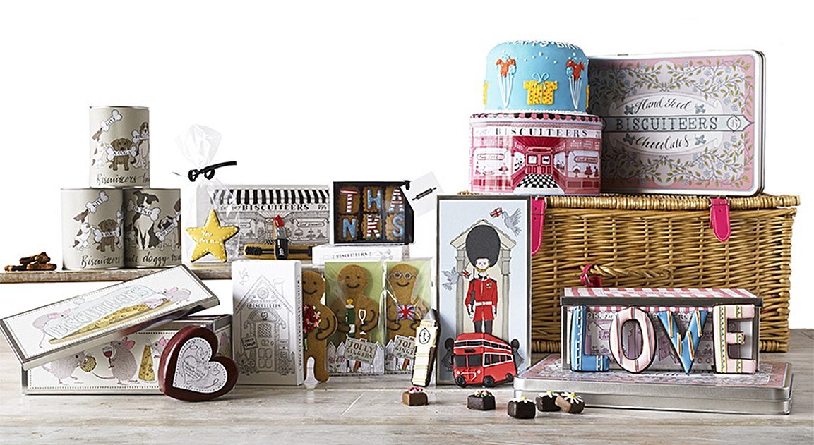 Festive Christmas biscuits by Biscuiteers, featuring personalized designs for corporate gifts and bespoke holiday treats.