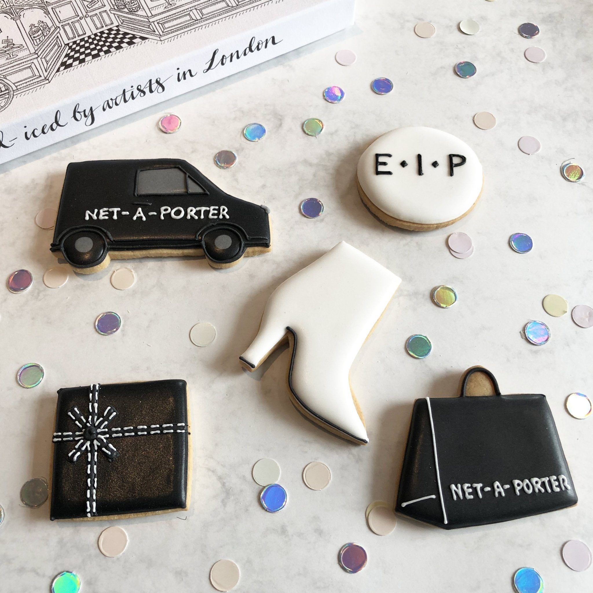 Net-A-Porter AW18 bespoke biscuits by Biscuiteers, featuring fashion trends, van, and gift bag for EIP Style Trial launch.
