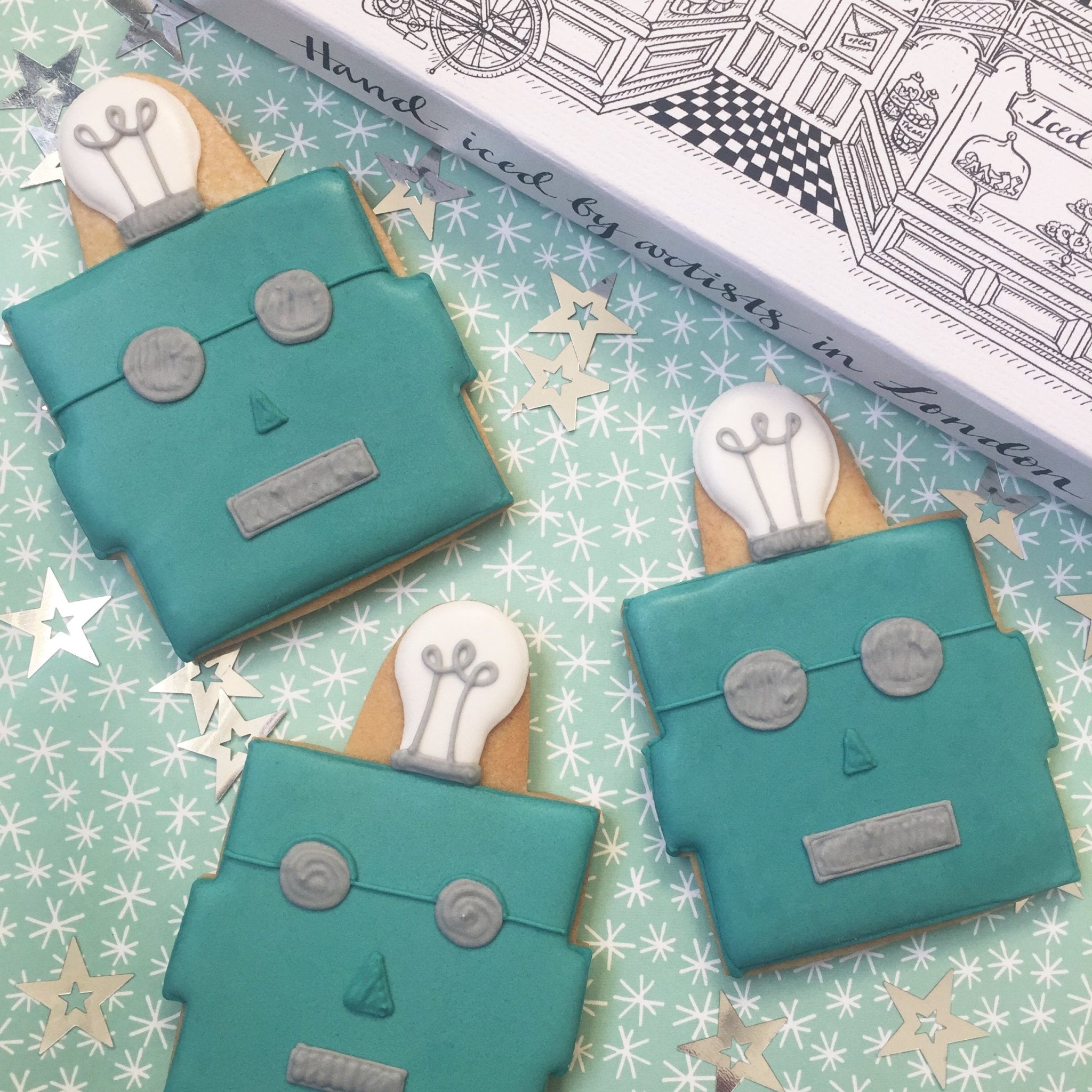 Tiffany & Co Christmas campaign biscuits by Biscuiteers, featuring hand-iced robot designs in signature Tiffany blue.