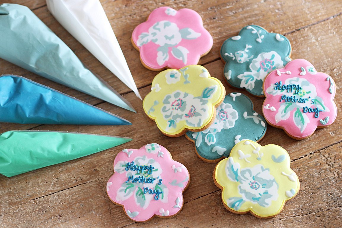 Mother's Day floral biscuits inspired by Cath Kidston prints, hand-iced by Biscuiteers for a personalized gift.