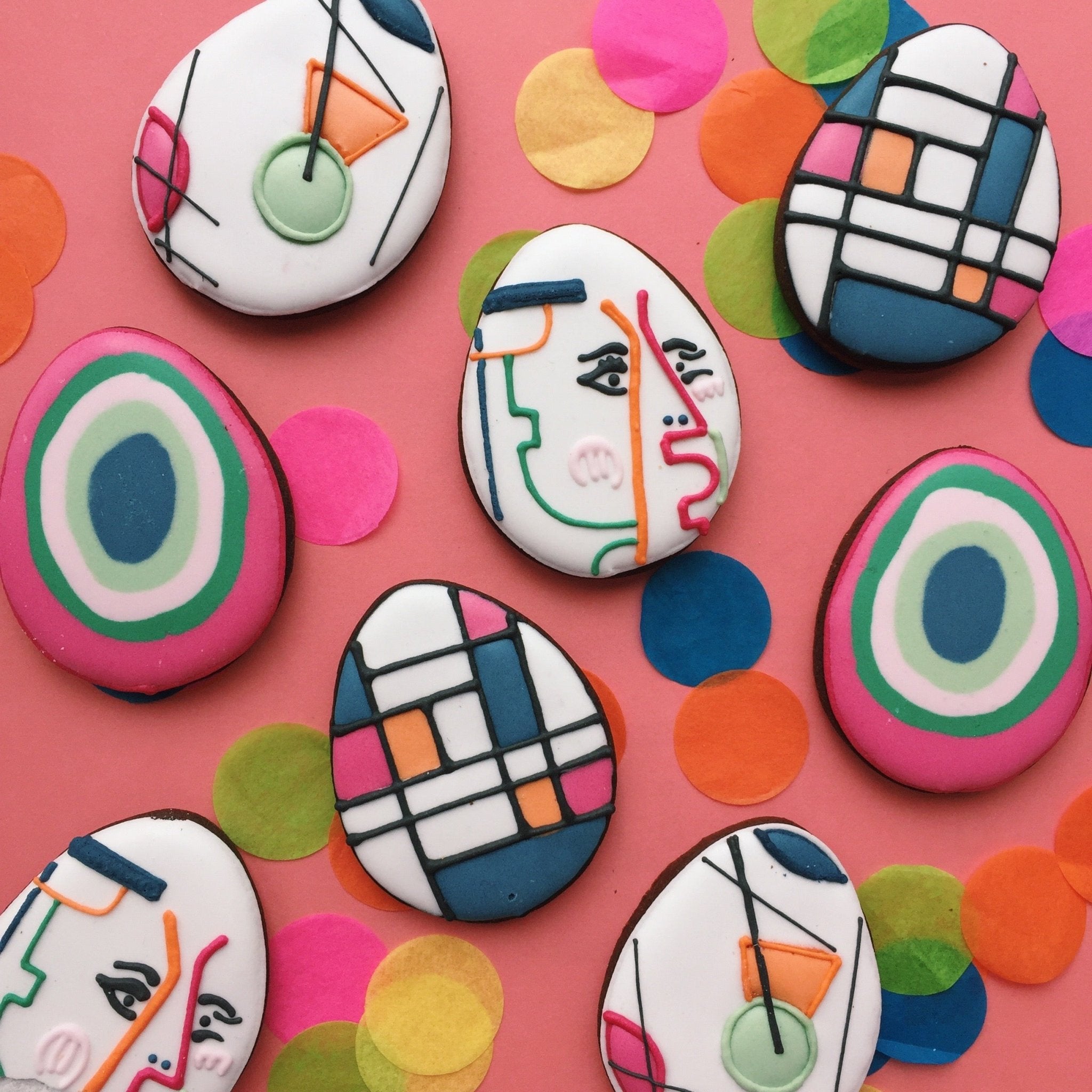 Easter-themed biscuits by Biscuiteers, featuring hand-iced designs, perfect for personalized employee gifts this spring.