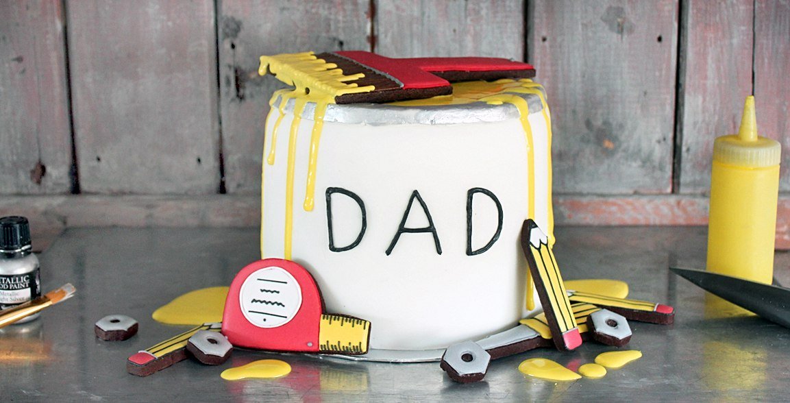 Father's Day DIY Cake with chocolate layers, buttercream, and tool-shaped biscuits by Biscuiteers for a personalized gift.