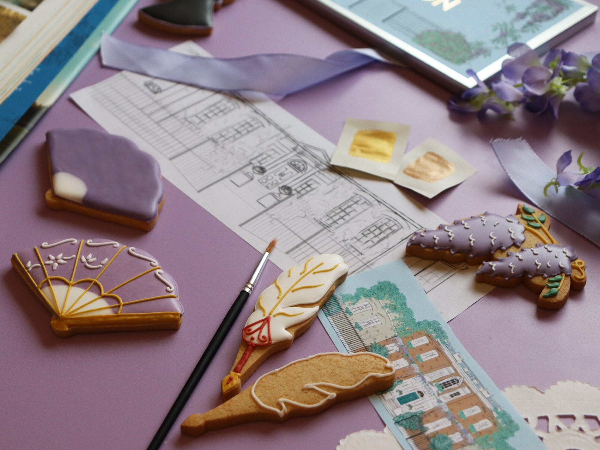 Bridgerton-inspired biscuits by Biscuiteers, featuring elegant designs for the social season, perfect for personalized gifts.