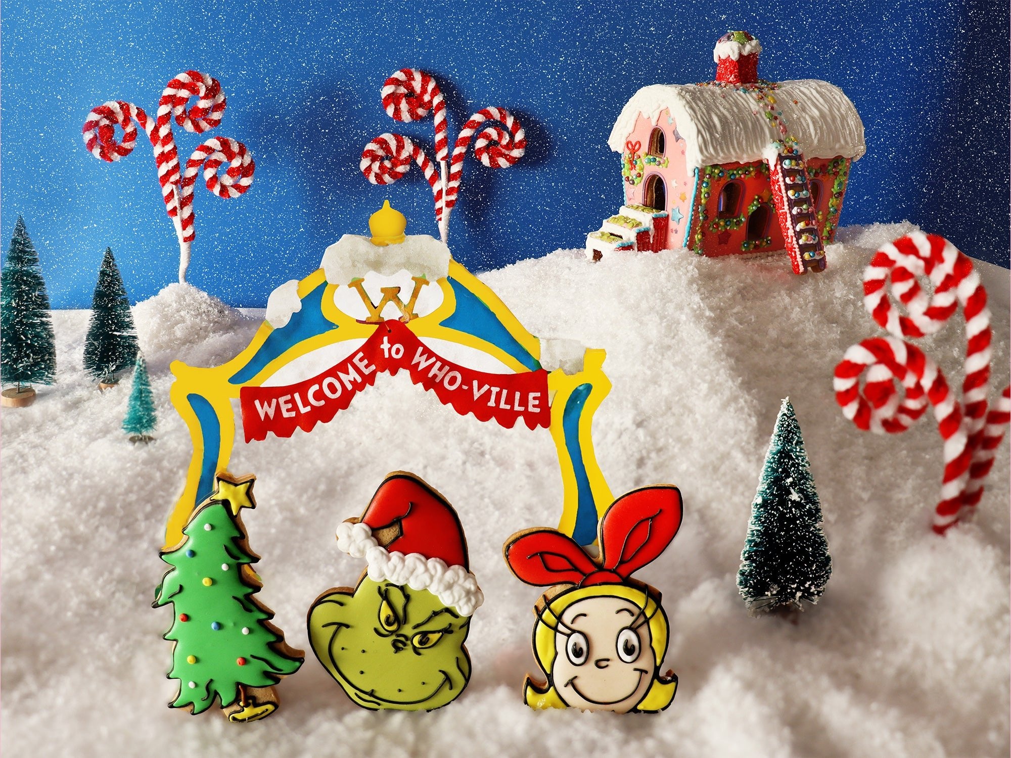 Grinch-themed biscuits by Biscuiteers for Christmas, featuring Whoville designs, perfect for personalized festive gifts.