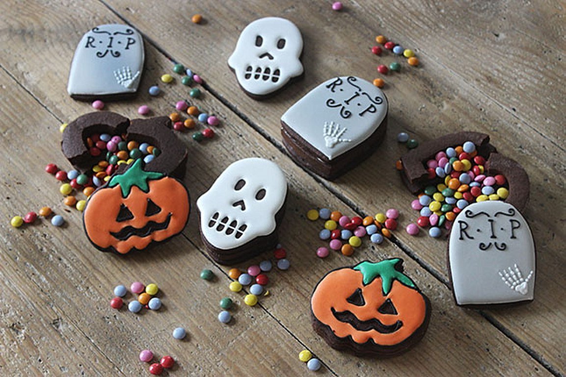 Halloween biscuits filled with colorful sweets, perfect for parties; a fun, spooky treat from Biscuiteers for the season.