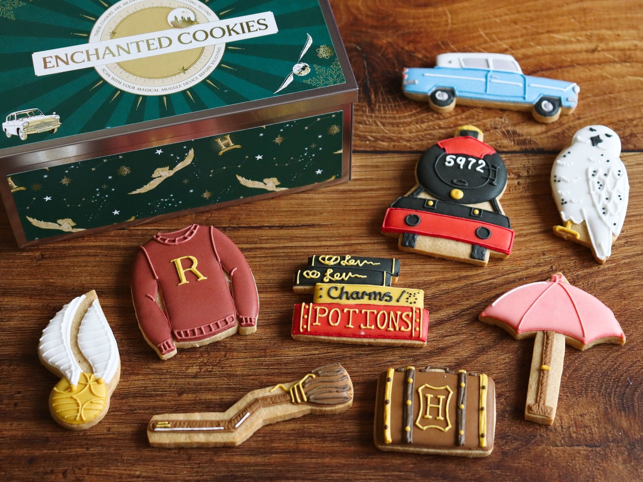 Harry Potter themed iced biscuits by Biscuiteers, featuring iconic symbols, perfect for personalized gifts and holiday occasions.