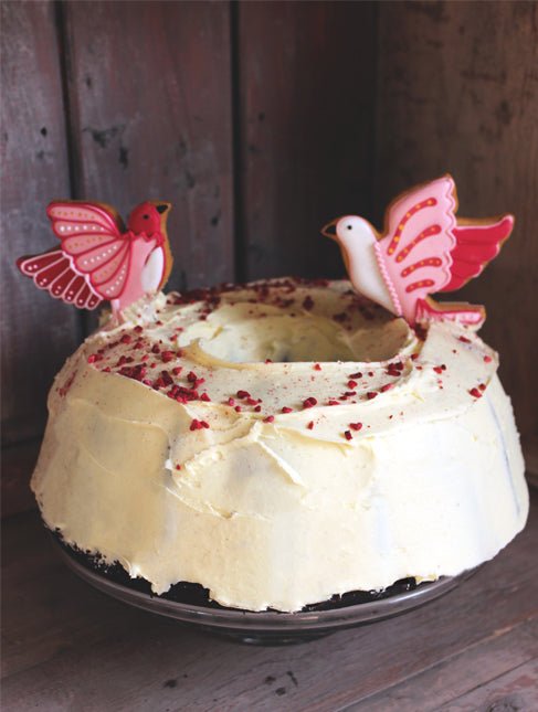 Red velvet cake with cream cheese frosting, perfect for Valentine's Day or personalized gifts from Biscuiteers.