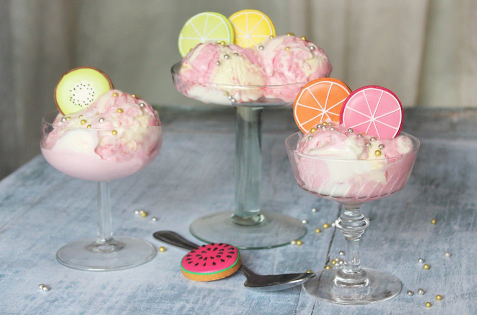 Homemade Strawberries and Cream ice cream with biscuit toppers, perfect for summer gatherings and personalized gifts by Biscuiteers.