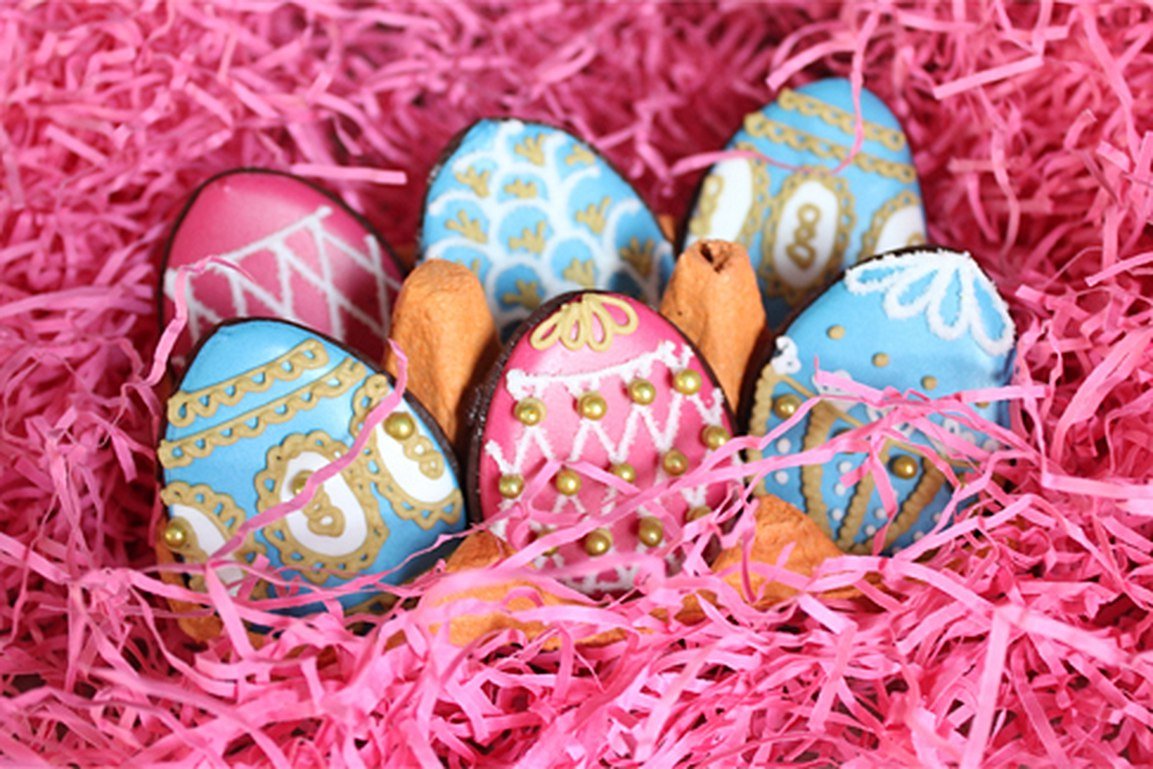 Easter chocolate biscuits with colorful icing, perfect for personalized gifts by Biscuiteers, ideal for Easter celebrations.