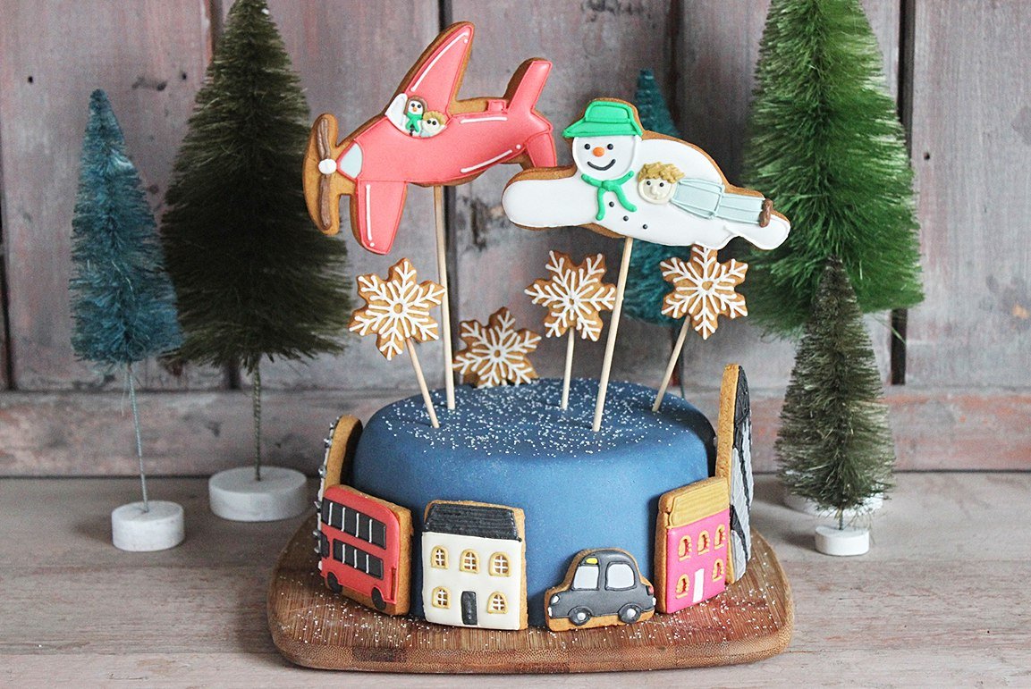 Biscuiteers Snowman cake with festive biscuits, perfect for Christmas; a personalized gift idea inspired by Raymond Briggs.