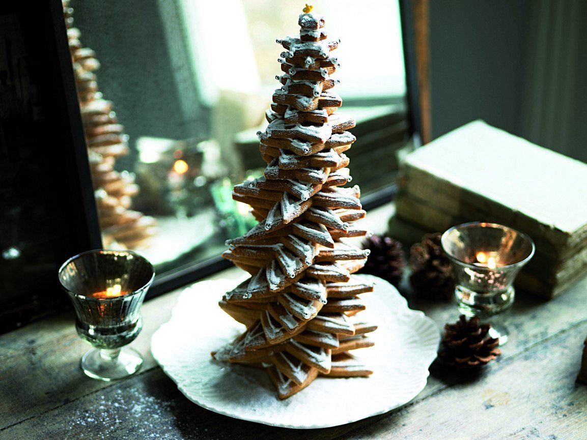Festive biscuit Christmas tree by Biscuiteers, made with cinnamon and orange, perfect for holiday gifts and celebrations.