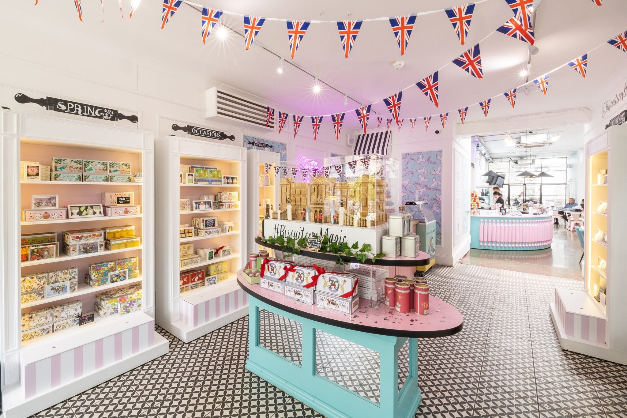 Biscuiteers Belgravia Icing Café interior with festive decor, showcasing personalized gifts and seasonal biscuit displays.