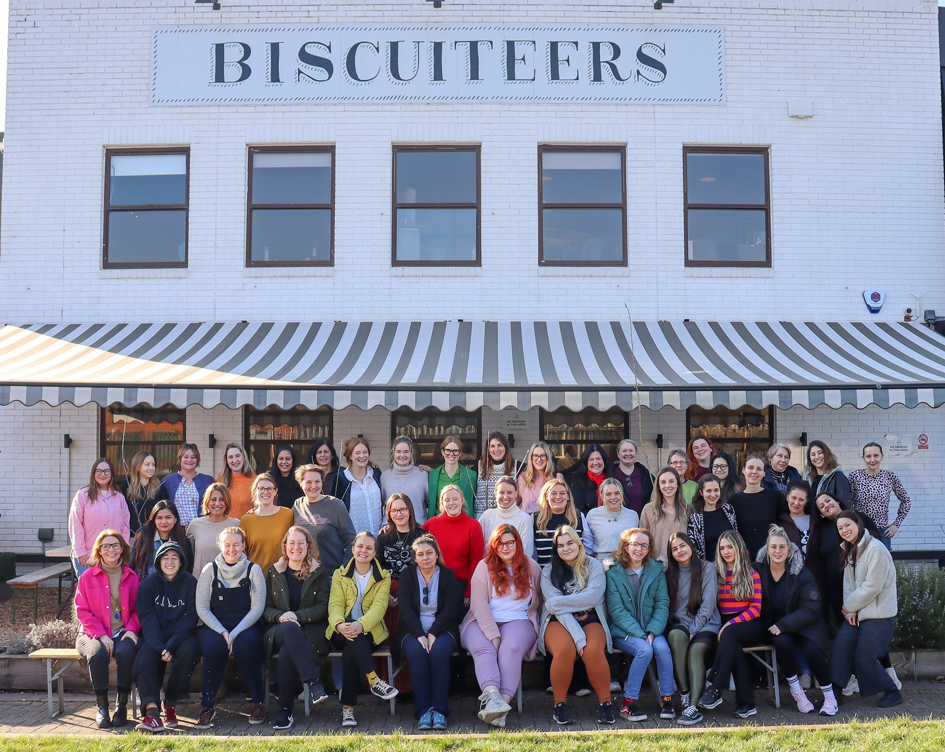 Biscuiteers' women-led team celebrates International Women's Day, promoting gender equality and personalized gifts.