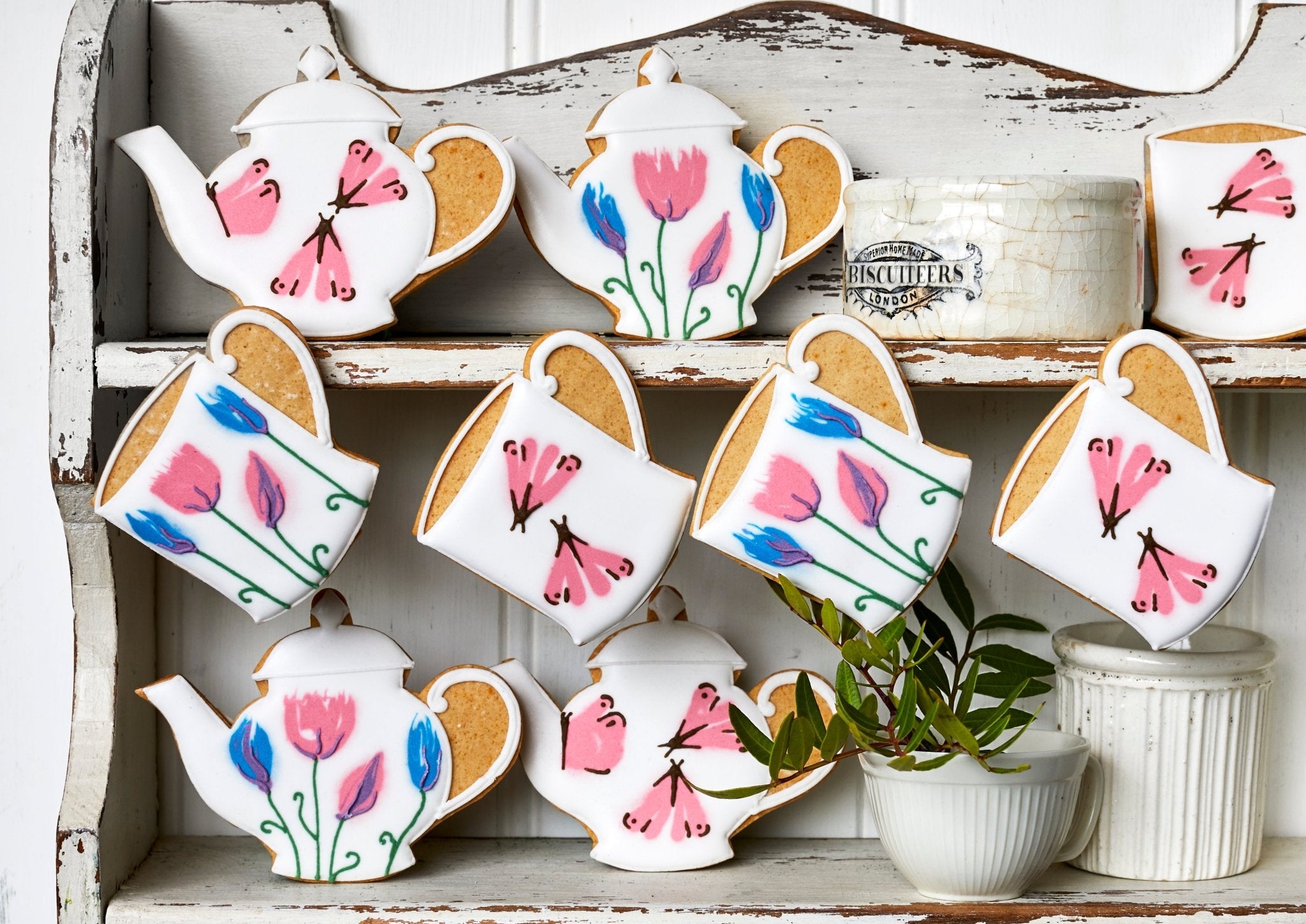 Emma Bridgewater and Biscuiteers Mother's Day biscuit tin with hand-iced lemon biscuits, sweet pea, and butterfly designs.