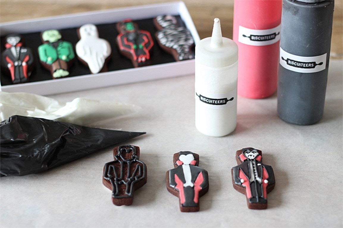 Halloween iced biscuits with Dracula design, perfect for spooky parties or personalized gifts by Biscuiteers.