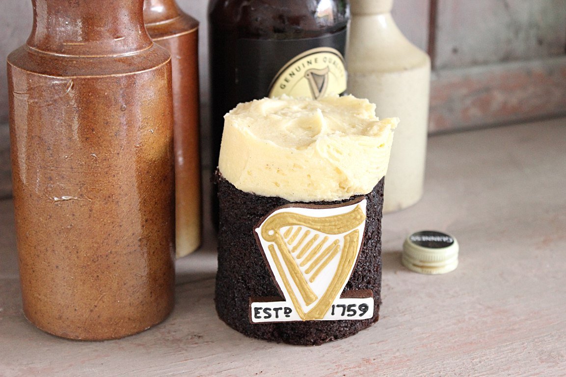 Decadent Guinness chocolate cake with creamy frosting, perfect for Father's Day celebrations and personalized gifts by Biscuiteers.