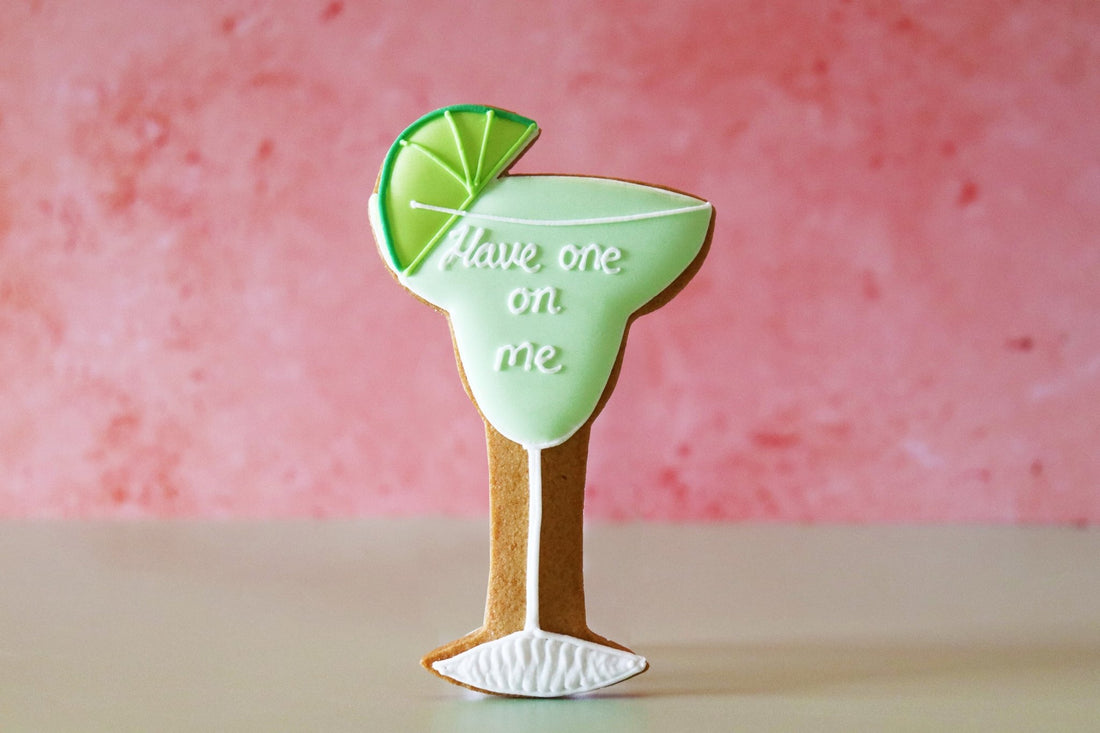 Hand-iced mojito-themed biscuits by Biscuiteers, perfect for 18th birthday gifts, showcasing unique, personalised gifting.