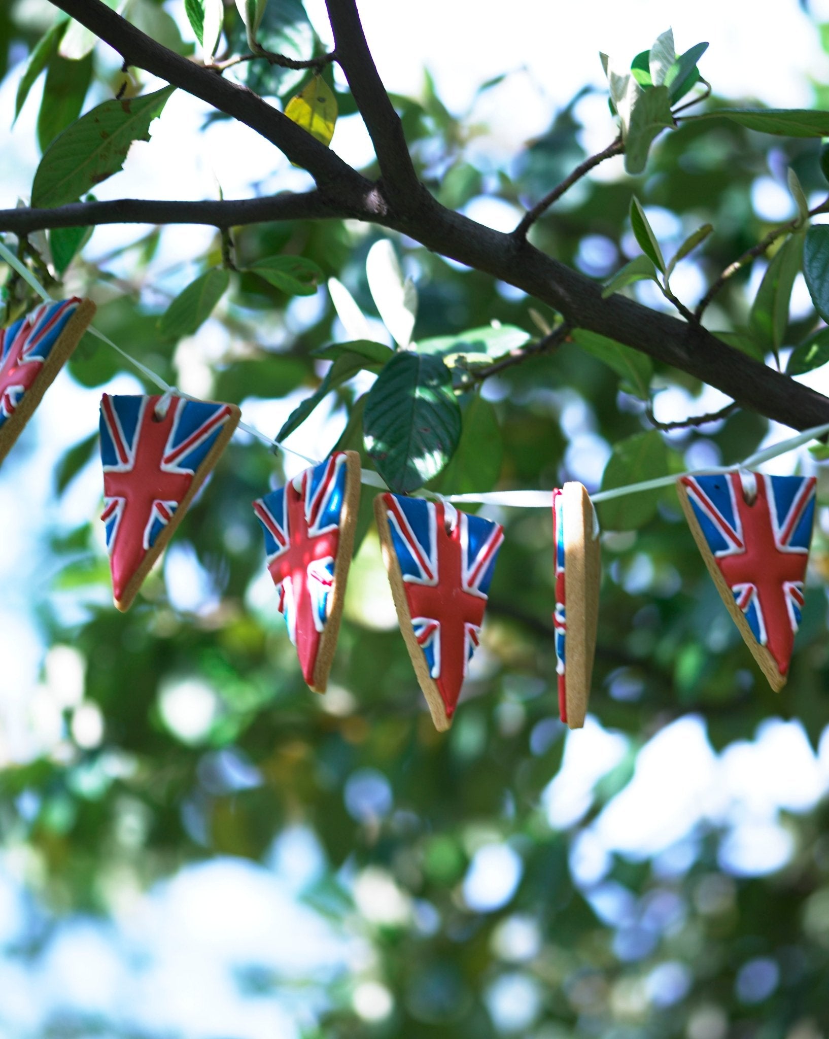 Hand-iced British biscuit bunting by Biscuiteers, perfect for Jubilee celebrations and personalized festive gifts.