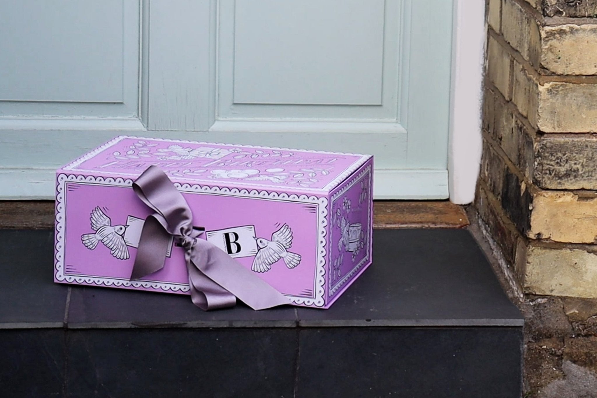 Biscuiteers delivery: beautifully wrapped, hand-iced biscuits arrive at your door, perfect for any occasion or personalized gift.