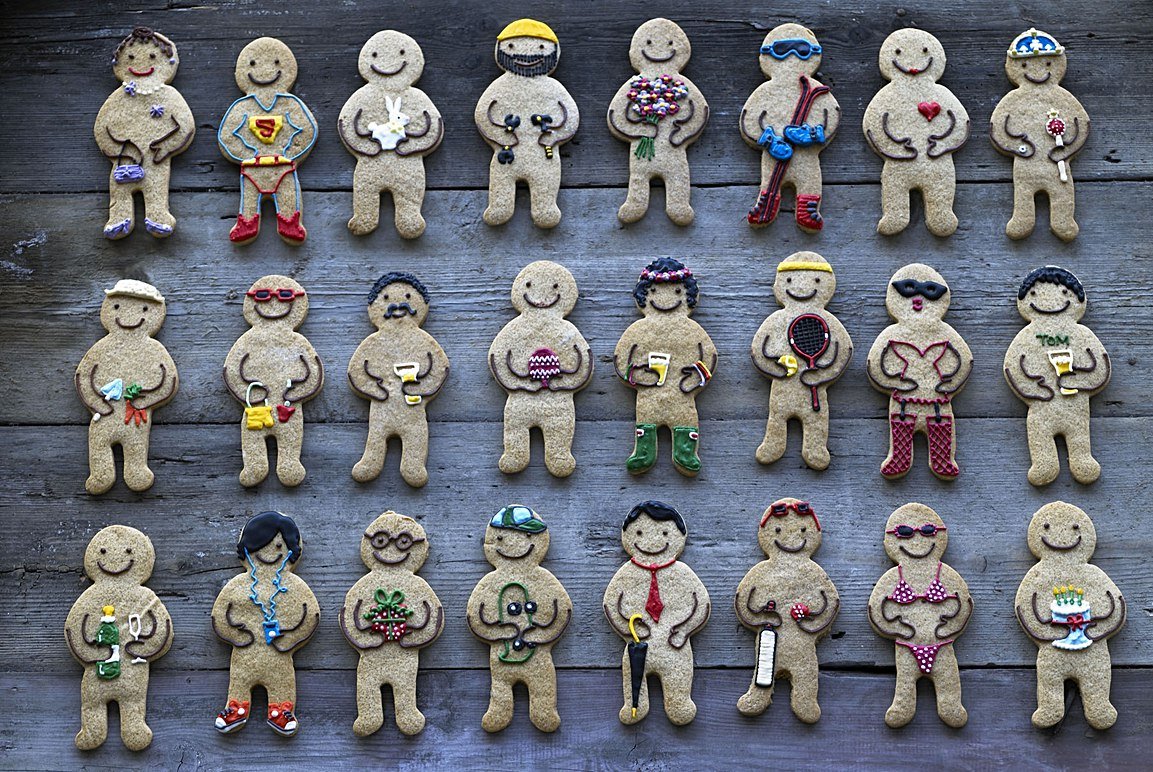 Jolly Gingerbread Man by Biscuiteers, perfect for festive gifts; decorated with icing, buttons, and a charming smile.