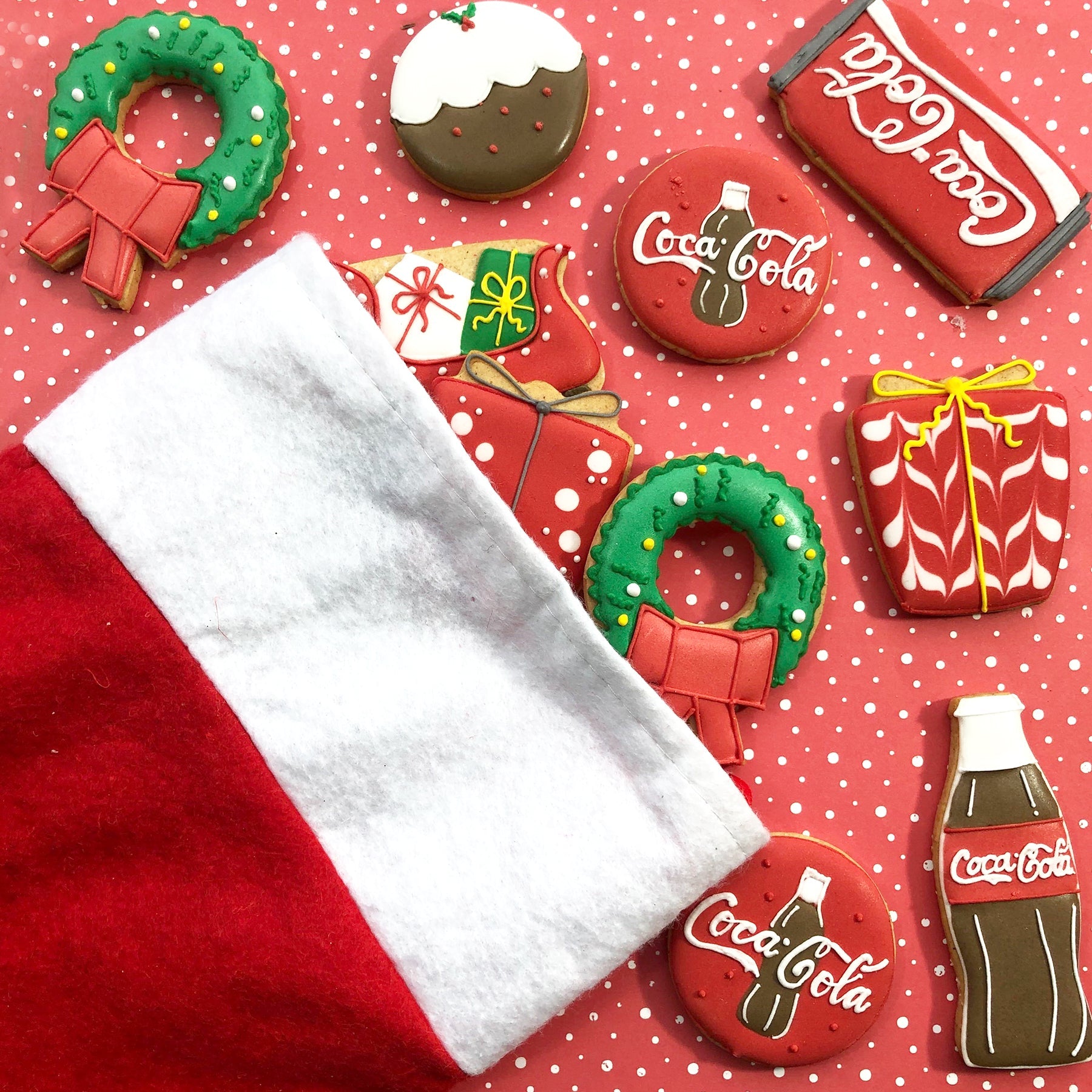 Coca Cola bespoke advent calendar with hand-iced biscuits by Biscuiteers for Christmas 2019, featuring iconic designs.
