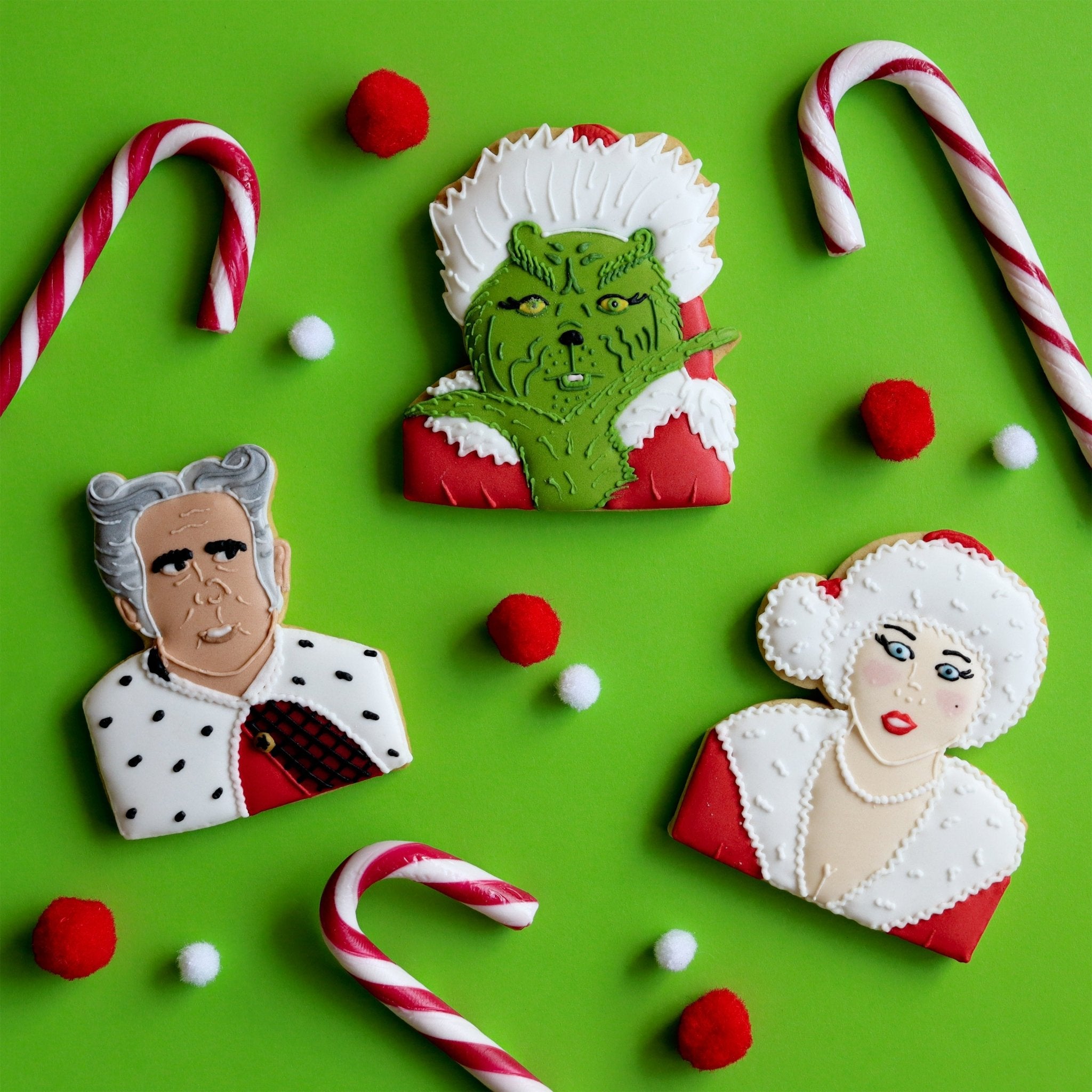 Grinch-themed Christmas biscuits by Biscuiteers, perfect for festive office parties and personalized holiday gifts.