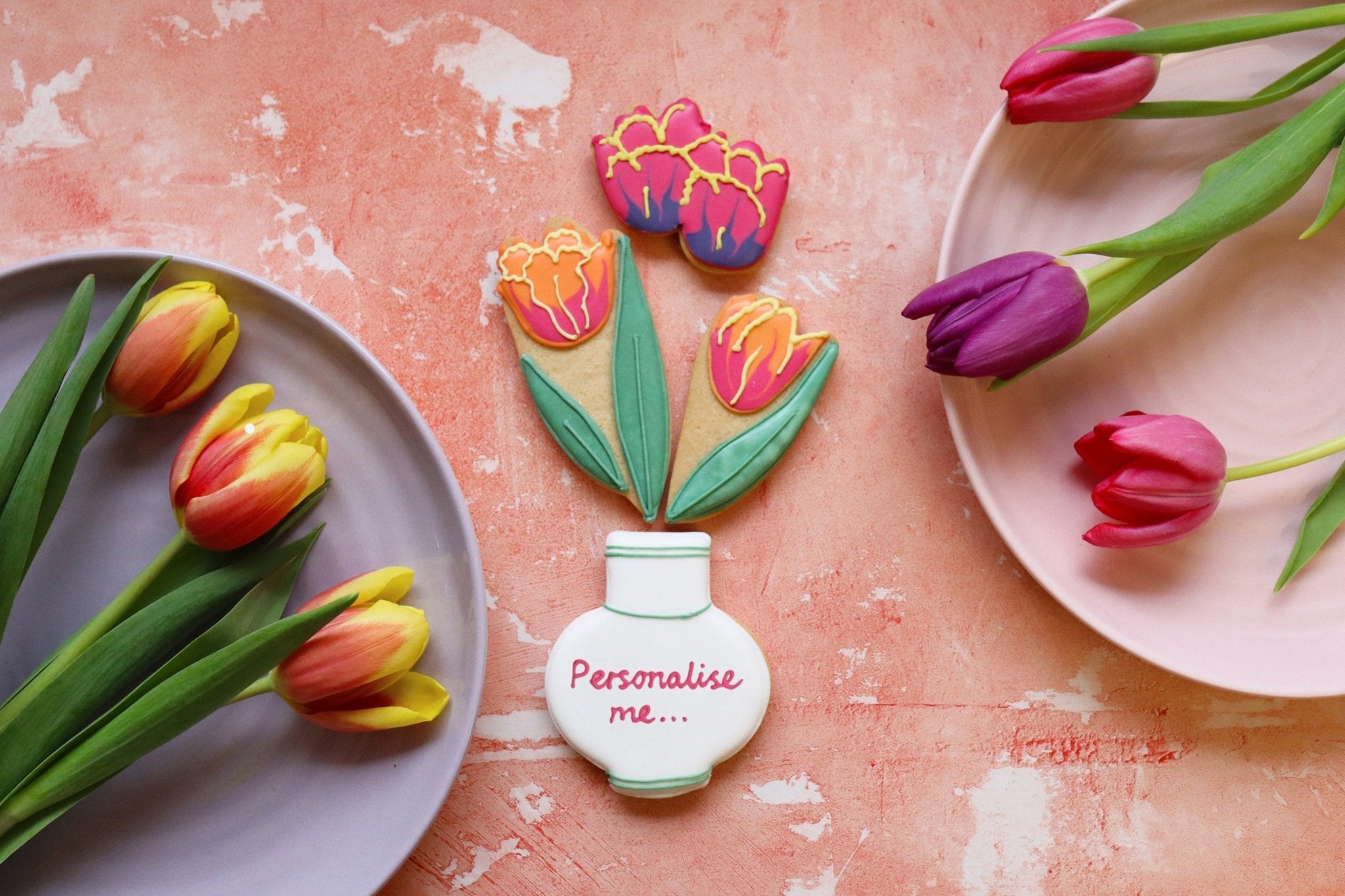 Hand-iced tulip biscuits in a gift box, perfect for spring occasions. Personalised gifts by Biscuiteers.